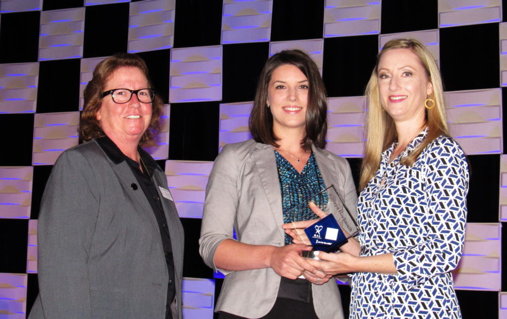 [Pictured Kathryn Hochmuth (middle) receiving the Impact Award from Statewide GAL Legal Director Kelly Swartz(left) and Ackerman’s Director of Pro Bono Initiatives Whitley M. Untiedt (right).]